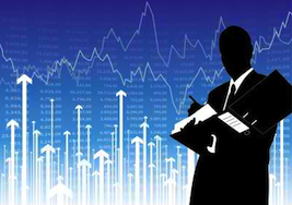 stock broker in front of stock market chart