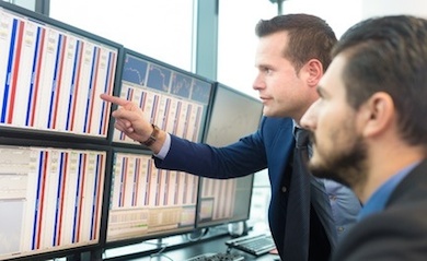 traders analyzing trading screen